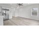 Open-concept kitchen and living area with wood-look flooring and stainless steel appliances at 402 N Battleground Ave, Kings Mountain, NC 28086