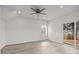 Spacious, bright living room with wood-look flooring and sliding glass door to backyard at 402 N Battleground Ave, Kings Mountain, NC 28086