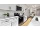 Modern kitchen featuring white shaker cabinets, stainless steel appliances, and white quartz countertops at 4428 Glenwood Dr, Charlotte, NC 28208