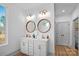 Bathroom with a double vanity and large circular mirrors at 5147 Star Magnolia Rd, Clover, SC 29710