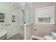 Spa-like shower with marble tile, pebble floor, and glass enclosure at 8007 Stevens Mill Rd, Matthews, NC 28104