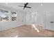 Light-filled living room featuring hardwood floors and a ceiling fan at 97 Lowe Nw Ave, Concord, NC 28027