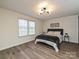 Cozy bedroom with neutral walls, wood-look flooring, and a window at 973 Tot Dellinger Rd, Cherryville, NC 28021