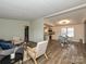 Open concept living and dining area with wood-look flooring and stylish furniture at 973 Tot Dellinger Rd, Cherryville, NC 28021