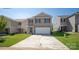 Two-story house with a white garage door and a landscaped lawn at 1063 Horizon Ln, York, SC 29745