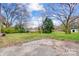 Private backyard with mature trees and a shed at 1105 Balthis Dr, Gastonia, NC 28054