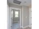 View of a bathroom through a doorway, showing a shower, window, and neutral-toned finishes at 111 Houpe Ridge Ln, Statesville, NC 28625