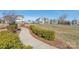 Curved community pathway with manicured landscaping and benches at 1209 Cedar Park Dr, Pineville, NC 28134