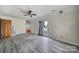 Bright bonus room featuring laminate floors and backyard access at 3147 Dawnshire Ave, Charlotte, NC 28216