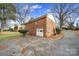 Brick home with attached garage and large driveway at 3147 Dawnshire Ave, Charlotte, NC 28216