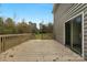 Wooden deck overlooking backyard with sliding door access at 3603 Twelve Mile Creek Rd, Weddington, NC 28104