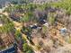 Aerial view of property showing home, detached workshop and expansive wooded lot at 5040 Spicewood Dr, York, SC 29745
