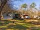 Property features a mobile home, shed and wooded area at 5040 Spicewood Dr, York, SC 29745