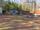 View of shed, firepit and wooded area in the backyard at 5040 Spicewood Dr, York, SC 29745