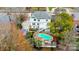 Backyard with pool, sport court, deck, and mature trees, viewed from above at 520 Beacon Knoll Ln, Fort Mill, SC 29708