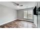 Bedroom with wood-look flooring, a ceiling fan, and a large window at 520 Beacon Knoll Ln, Fort Mill, SC 29708