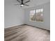 Bright bedroom with wood-look flooring and ceiling fan at 5680 Gold Creek Bay None, Hickory, NC 28601