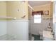 Bathroom with shower, toilet and shelving at 808 Mark St, Belmont, NC 28012