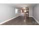 Dining room with tile floors and kitchen access at 808 Mark St, Belmont, NC 28012