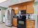 Stainless steel appliances and ample wood cabinetry in this kitchen at 944 Pleasant Ridge Rd, Fort Mill, SC 29715