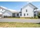 Rear view of a white house with fenced backyard and patio at 122 Mint Ave # D, Mooresville, NC 28117