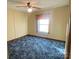 Charming bedroom with window, fan and blue carpet at 126 Beechwood Dr, Salisbury, NC 28147