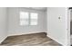 Bright bedroom with hardwood floors and window coverings at 133 Morning Gap Pkwy, Fort Mill, SC 29715