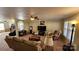 Open living room showcasing a large sectional sofa and neutral decor at 156 Boiling Brook Dr, Statesville, NC 28625