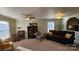 Living room featuring neutral tones, comfortable seating, and natural light at 156 Boiling Brook Dr, Statesville, NC 28625