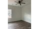 Bedroom featuring a ceiling fan, large window, and wood-look flooring at 1713 N Clay St, Salisbury, NC 28144