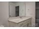 White bathroom vanity with a large mirror at 257 Donsdale Dr, Statesville, NC 28625