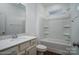 Clean and simple bathroom with white vanity, shower/tub combo, and wood-look flooring at 257 Donsdale Dr, Statesville, NC 28625