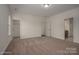 Spacious bedroom with neutral carpet, walk-in closet, and ensuite bathroom access at 257 Donsdale Dr, Statesville, NC 28625