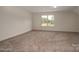 Spacious, empty bedroom with neutral carpet and window at 257 Donsdale Dr, Statesville, NC 28625
