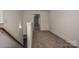 Carpeted hallway with a wooden railing and white walls at 257 Donsdale Dr, Statesville, NC 28625