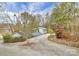 Elevated view of a driveway leading to a house with trees and landscaping at 296 Southfork Rd, Mooresville, NC 28117