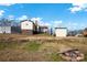 Spacious backyard with a fire pit, storage shed, and mature trees at 45 Sunderland Rd, Concord, NC 28027