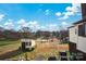 Spacious backyard with a storage shed, basketball court, and grassy area at 45 Sunderland Rd, Concord, NC 28027
