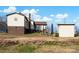 Backyard view with grassy area, storage shed, and retaining wall at 45 Sunderland Rd, Concord, NC 28027