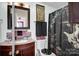 Bathroom with dark wood vanity, decorative shower curtain, and tile accents at 45 Sunderland Rd, Concord, NC 28027
