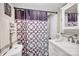 Bathroom with white vanity, shower/tub combo, and patterned curtain at 45 Sunderland Rd, Concord, NC 28027