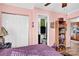 Pink bedroom with purple bedding, closet, and ensuite bathroom access at 45 Sunderland Rd, Concord, NC 28027