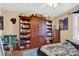 Bedroom with large wooden entertainment center, bed, and fish tank at 45 Sunderland Rd, Concord, NC 28027