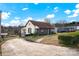 One-story house with a screened porch, driveway, and landscaping at 45 Sunderland Rd, Concord, NC 28027