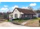 Charming one-story home with a screened porch and a paved driveway at 45 Sunderland Rd, Concord, NC 28027