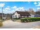 Front view of a one-story home with screened porch and landscaping at 45 Sunderland Rd, Concord, NC 28027