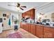 Kitchen with brown cabinets, countertops, and tile floor at 45 Sunderland Rd, Concord, NC 28027