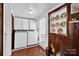 Laundry room with washer, dryer, wood-paneled walls at 45 Sunderland Rd, Concord, NC 28027
