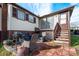 Brick patio with outdoor grill, seating area, and stairs leading to the house at 45 Sunderland Rd, Concord, NC 28027