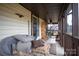 Spacious screened porch with wicker furniture and decor at 45 Sunderland Rd, Concord, NC 28027